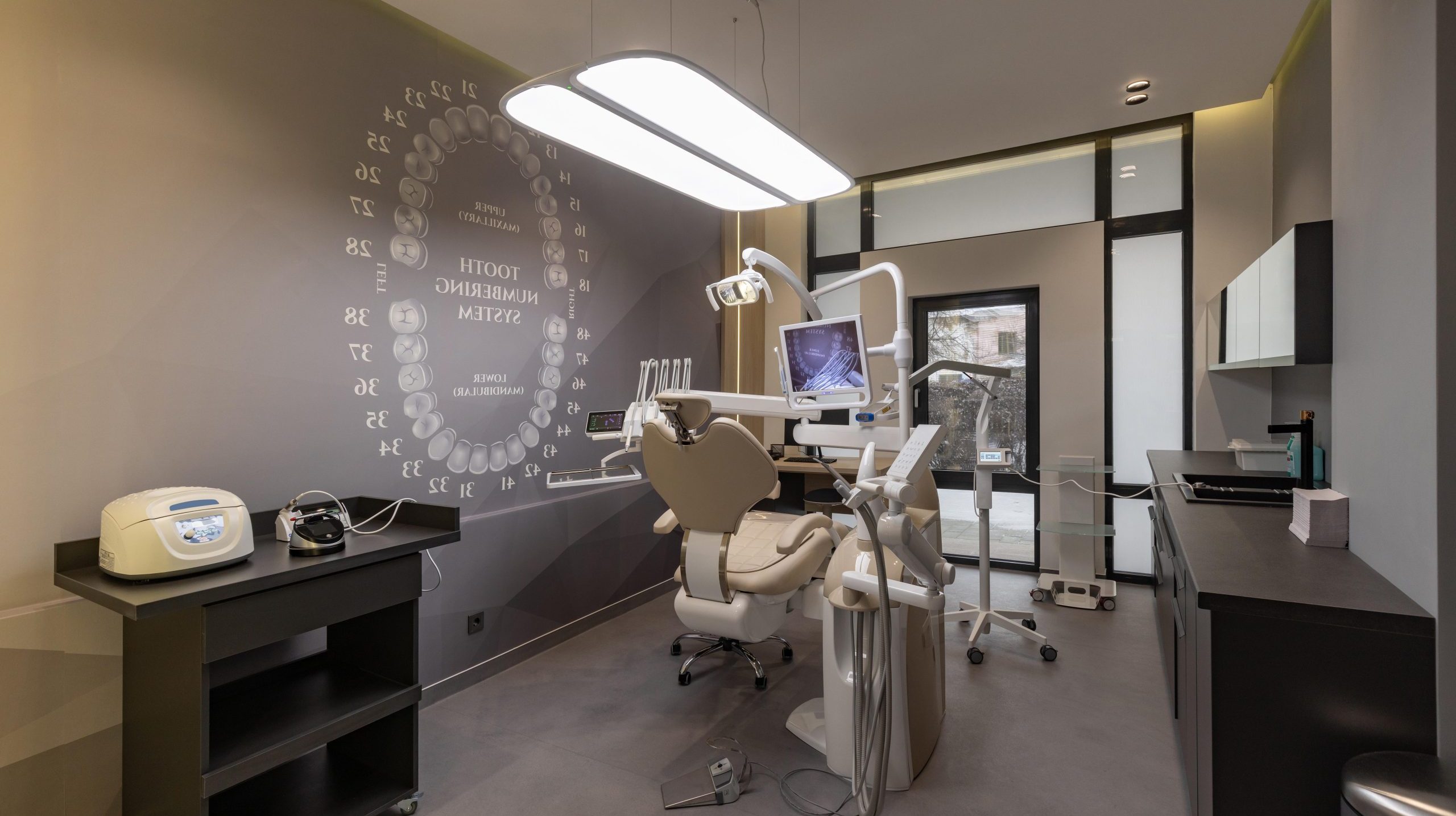 Interior of modern dentistry medical room with special equipment